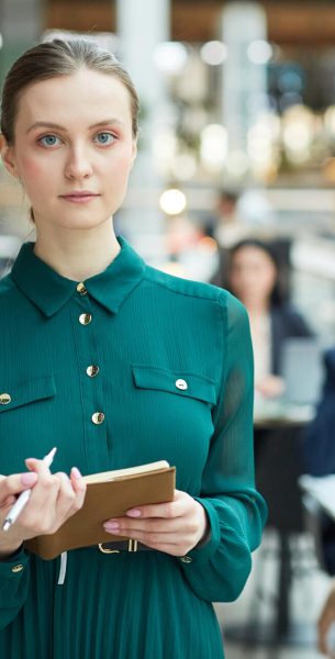 portrait-of-young-woman-in-office-building-2025-03-09-08-51-41-utc-e1750747050555.jpg